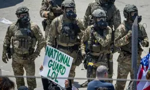 DOJ Sues California Over Mask Ban, ID Rules For Feds