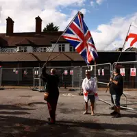 Asylum-seekers can remain in UK hotel after government wins appeal to keep it open