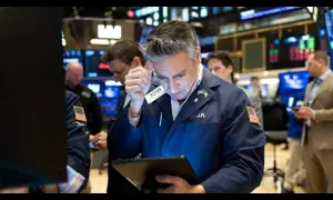 Wall Street opens mostly lower as data pour in
